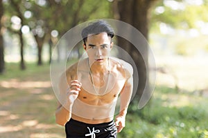 Fittness asian  man doing exercises in the park