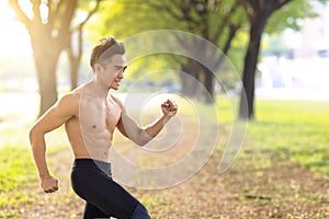 Fittness Young man doing exercises in the city park