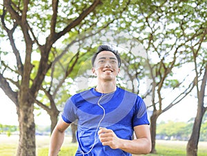 Fittness Young man jogging in the park