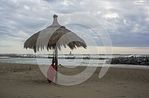 Fiumicino beach in winter. Umbrella on the beach