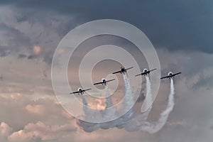 Five airplanes formation at an air show