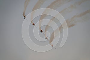 Five airplanes in formation on airshow. Aerobatic team performs flight at air show