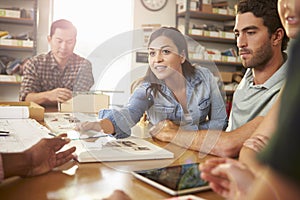 Five Architects Sitting Around Table Having Meeting