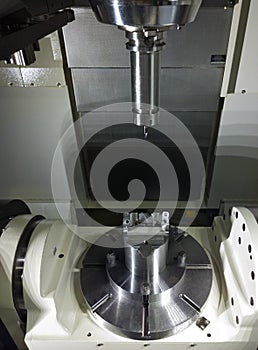 The five-axis Computer Numerical Control CNC machine waiting for stock change