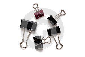 Five Binder clip pieces of different sizes, one red