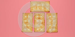 Five biscuits overlapped against a pink background