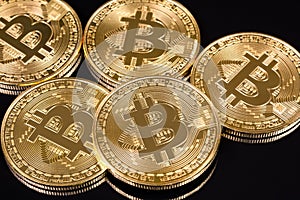 Bitcoin coins on black background