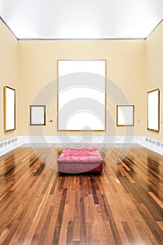 Five blank frames in a gallery