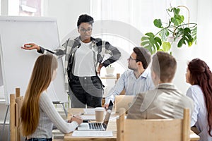 Five businesspeople at seminar in conference room