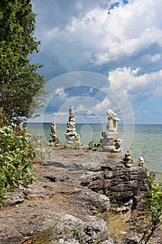 Five cairns on the rocky shoreline of Lake Michigan in Sturgeon Bay, Wisconsin