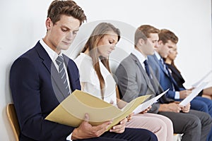 Five candidates waiting for job interviews, close up photo