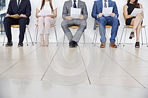 Five candidates waiting for job interviews, front view, crop photo
