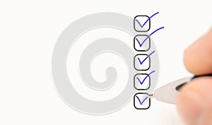 five checkboxes. hand with pen writing check mark on Checklist. Cropped Hand Marking On Check Box on white paper. Completed tasks