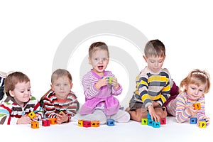 Five children playing blocks