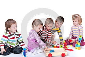 Five children playing toys