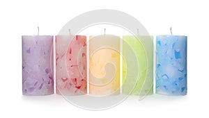 Five color wax candles on white