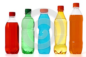 Five colored bottles with juice and soda
