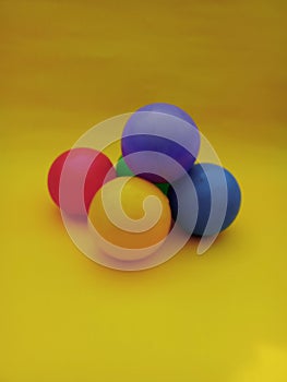 five colorful plastic ball