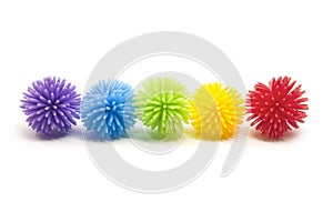 Five Colorful Stess Koosh Balls in a line