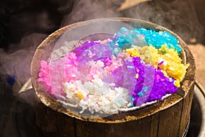 Five-coloured rice in bamboo steamer