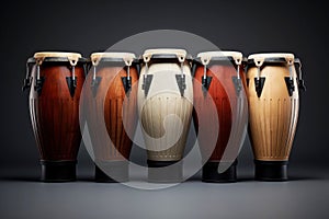 Five conga drums in row isolated on dark background. Traditional percussion musical instrument of Afro-Cuban and Latin