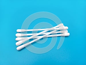 Five Cotton Ear Buds Isolated On Blue background