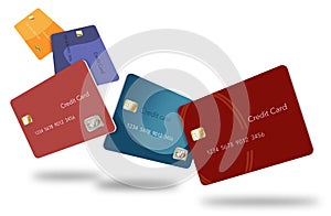 Five credit cards in various colors float through the air in this image.