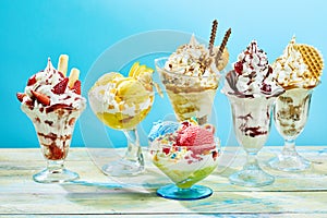 Five differ flavor ice cream sundaes