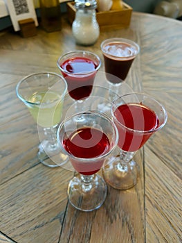 Five different alcoholic tinctures in glasses