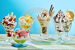 Five different flavor ice cream sundaes