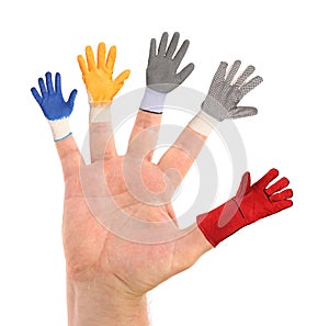 Five different small gloves wearing a hand