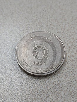 A five dollar coin of Hong Kong