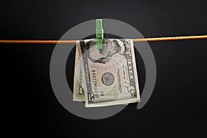 Five dollars was fixed on a rope with a green clothespin