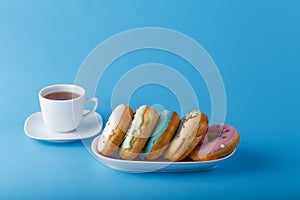 Five donuts on blue background