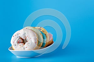 Five donuts on saucer