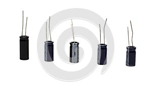 Five electrolytic capacitors on a white background