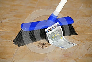 Five Euro Banknote and a Broom