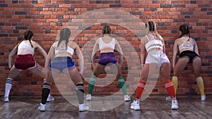 Five girls in sports shorts and leggings dance twerk.