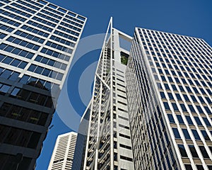 Five glass sided skyscrapers perfect Blue sky