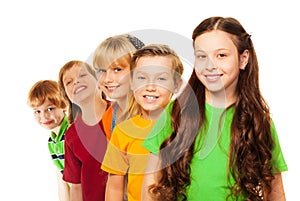 Five happy kids standing in a line