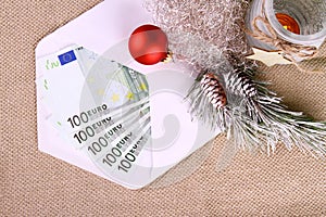 Five hundred euro money in envelope with Christmas decor