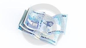 five hundred riyal qatari banknotes stacks isolated on white background,