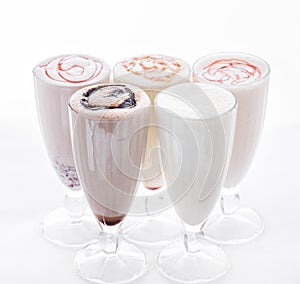 Five Ice Cream Shakes. Delicious ice cream float, vanilla, strawberry, coffee, chocolate and white background