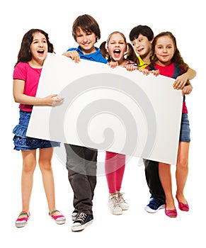 Five kids showing blank board