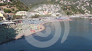 Five Lands, Italy - summer2020: tourists stroll on the beach of Moneglia, timelapse video