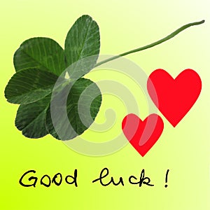 Five-leaf clover with two red hearts and Good luck