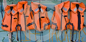 Five life jackets in a row