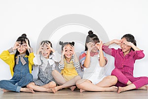 Five little girls raising their hands photo