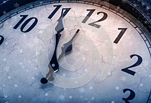 Retro clock with five minutes before twelve.