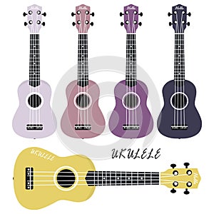 Five multi-colored ukulele on a white background. Musical instruments